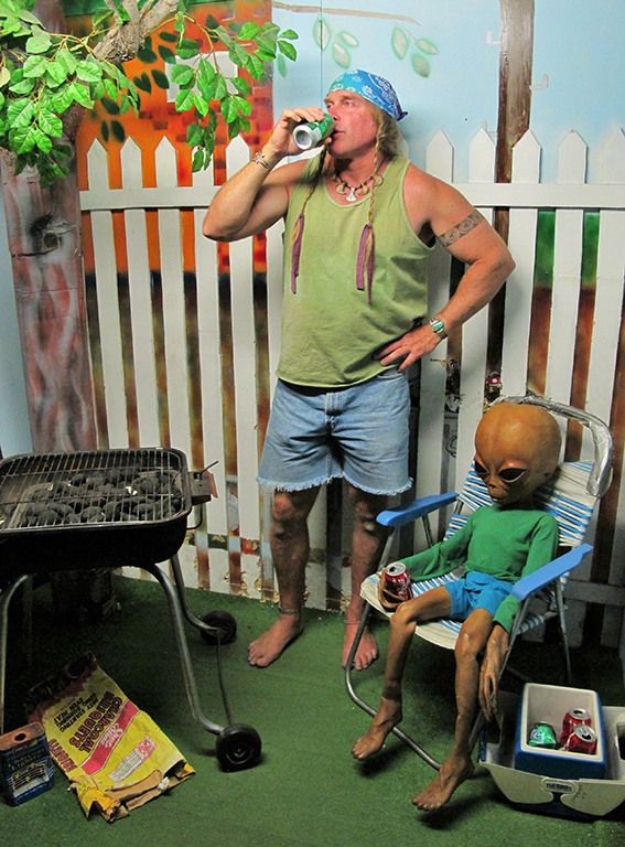 Man at a BBQ with an alien