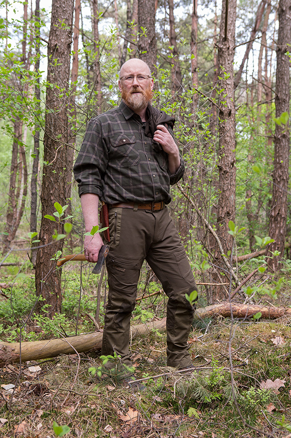 Woodsman with ginger beard holding an axe